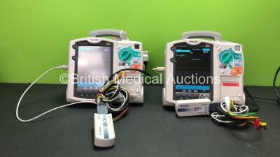 2 x Philips MRx Defibrillators Including Pacer, ECG and Printer Options with 2 x Philips M3538A Batteries, 2 x Philips M3539A Modules, 2 x Paddle Leads, 2 x Philips M3725A Test Loads and 2 x 3 Lead ECG Leads (Both Power Up) *SN US00332946 - US00214824*