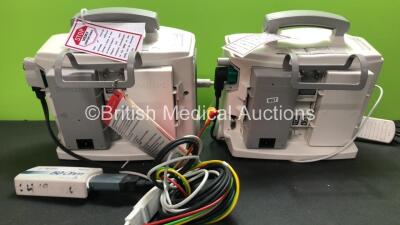 2 x Philips MRx Defibrillators Including Pacer, ECG and Printer Options with 2 x Philips M3538A Batteries, 2 x Philips M3539A Modules, 2 x Paddle Leads, 2 x Philips M3725A Test Loads and 2 x 3 Lead ECG Leads (Both Power Up) *SN US00332946 - US00214824* - 5