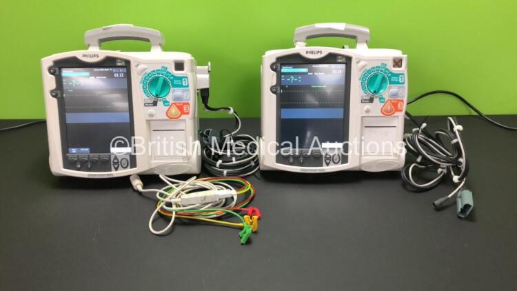 2 x Philips Heartstart MRx Defibrillators Including 2 x Pacer, 2 x ECG, 1 x BP, 1 x SpO2 and 2 x Printer Options with 2 x Philips M3538 Modules, 2 x Paddle Leads and 1 x ECG Lead *Mfd Both 2008* (Both Power Up) *US00326440 - US00322671*