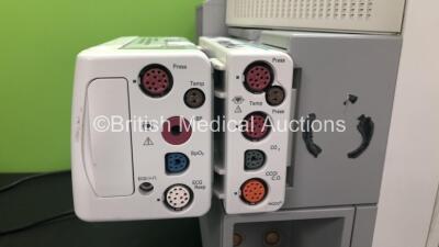 2 x Philips IntelliVue MP70 Anaesthesia Patient Monitors *Mfds -2010 and 2010* (Both Power Up) with 1 x Philips M3014A Opt : C10 Multiparameter Module with Press, Temp, ECG and CO2 Options and 1 x Multiparameter Module with Press, Temp, ECG and CO2 Option - 3