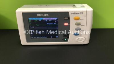 2 x Philips IntelliVue X2 Patient Monitors with Press, Temp, NBP, SPO2 and ECG Resp Options and 2 x Batteries *Mfds - 2009 and 2015* (Both Power Up, 1 Damaged Casing - See Photo) - 2