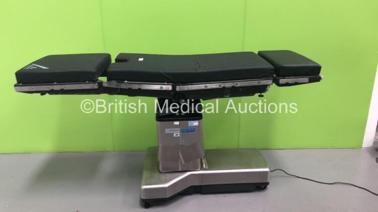 Steris Amsco 3085 SP Electric Operating Table with Cushions (Powers Up - Lower Ram Metal Trims Damaged - See Pictures) *S/N FS0073018*