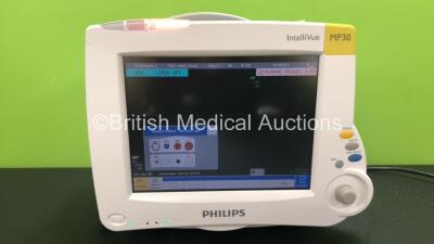 Philips MP30 IntelliVue Touch Screen Patient Monitor with 1 x Philips M3001A Opt A01C06 Module Including ECG/Resp, SpO2, NBP, Press and Temp Options, 1 x Philips M3015A Opt C06 Module Including CO2, Press and Temp Options (Powers Up) *Mfd 03-2007*