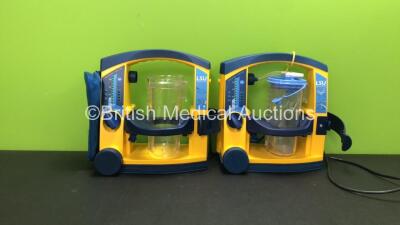 2 x Laerdal LSU Suction Units with Cups (Both Power Up, 1 with Missing Lid)