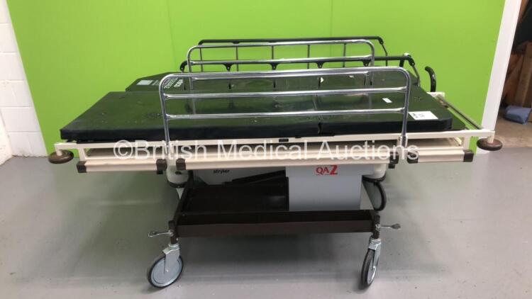 1 x Huntleigh Hydraulic Patient Trolley with Mattress and 1 x Stryker Transport Hydraulic Patient Trolley with Mattress (Hydraulics Tested Working)