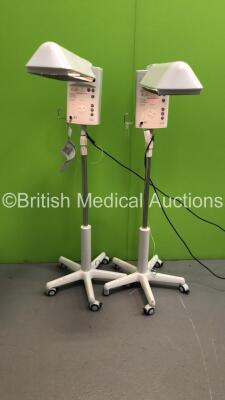 Fisher and Paykel Servo Mobile Infant Warmers on Stands (Both Power Up) *S/N 061213001499 / 070209000181*