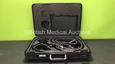 Olympus CF-1T200L Video Colonoscope In Carry Case Engineer's Report : Optics -Ok, Angulation - Bending Section Seized, Patient Tube - Badly Worn and Bending Section Rubber not Secured, Light Transmission - Ok, Channel System - Ok , Leak Check- Leaking Ins
