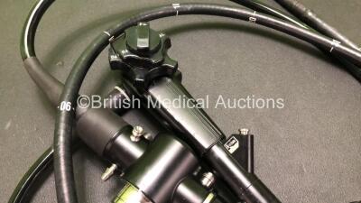 Olympus CF-1T200L Video Colonoscope In Carry Case Engineer's Report : Optics -Ok, Angulation - Bending Section Seized, Patient Tube - Badly Worn and Bending Section Rubber not Secured, Light Transmission - Ok, Channel System - Ok , Leak Check- Leaking Ins - 3