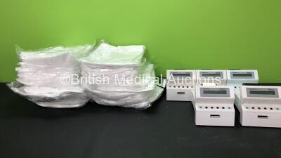 Mixed Lot Including Large Quantity of XL Disposable Overcoats and 5 x Bayer Clinitek 50 Urine Analyzers with 1 x AC Power Supply (4 Power Up, 1 No Power, 1 with Error)