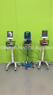 2 x Mindray VS-900 Patient Monitors on Stands with SPO2 Finger Sensors and 1 x GE Dinamap Vital Signs Monitor on Stand (Missing Front Cover) (All Power Up) *S/N FV67011800 / FV67011809*