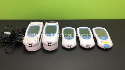 5 x Roche Coaguchek XS Plus Blood Coagulation Monitors (4 x Power Up, 1 No Power) with 2 x Roche Handheld Base Units and 4 x AC Power Supply (Some Missing Casing - See Photos)