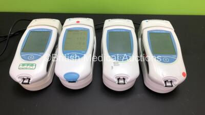 4 x Roche Coaguchek XS Plus Blood Coagulation Monitors with 4 x Roche Handheld Base Units and 4 x AC Power Supply (All Power Up with Some Missing Casing - See Photos)