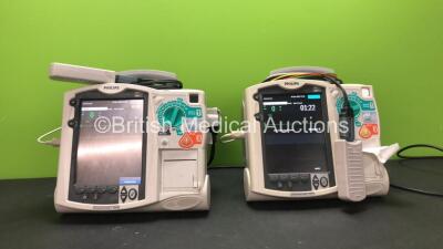 2 x Philips MRx Defibrillators Including Pacer, ECG and Printer Options with 2 x Philips M3538A Batteries, 2 x Philips M3539A Modules, 2 x Paddle Leads, 2 x 3 Lead ECG Leads and 2 x Philips M3725A Test Loads (Both Power Up) *SN US00534793 - US00322233*