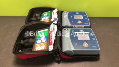 2 x Philips Heartstart FR2+ Defibrillators with 2 x Philips M3863A Batteries *Install Dates 08-2021, 08-2018* (Both Power Up and Pass Self Tests) *SN 1011890116, 0104108589*