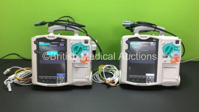 2 x Philips Heartstart MRx Defibrillators Including Pacer, ECG and Printer Option with 2 x Philips M3539A Batteries, 2 x Philips M3538 Module, 2 x ECG Leads and 2 x Paddle Lead (Both Power Up) *SN US00539115 - US00534794*