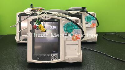 3 x Philips Heartstart MRx Defibrillators Including Pacer, ECG and Printer Options, 3 x Philips M3538A Batteries, 3 x Philips M3539A Modules, 3 x Paddle Leads and 2 x 3 Lead ECG Leads (All Power Up)