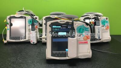 4 x Philips Heartstart MRx Defibrillators Including Pacer, ECG and Printer Options, 4 x Philips M3538A Batteries, 4 x Philips M3539A Modules, 4 x Paddle Leads, 4 x Philips M3725A 50 Ohm Test Loads and 4 x 3 Lead ECG Leads and 4 x 3 Lead ECG Leads (All Pow