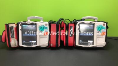 2 x Philips Heartstart MRx Defibrillators Including ECG and Printer Options, 2 x Philips M3538A Batteries, 2 x Philips M3539A Modules, 2 x Paddle Leads *Mfd 2011 - 2004* (Both Power Up) *US00553296 - US00316625*