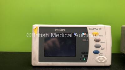 2 x Philips IntelliVue X2 Handheld Patient Monitors Software Versions G.01.80, G.01.75 Including ECG, SpO2, NBP, Temp and Press Options (Both Power Up, 1 with Damage-See Photo) *Mfd 08-2009, 11-2011* *SN DE03785844, DE83629828* *C* - 2