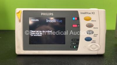 2 x Philips IntelliVue X2 Handheld Patient Monitors Software Versions G.01.80, G.01.75 Including ECG, SpO2, NBP, Temp and Press Options (Both Power Up, 1 with Damage-See Photo) *Mfd 08-2009, 11-2011* *SN DE03785844, DE83629828* *C* - 3