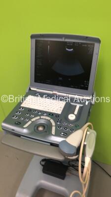 GE Voluson i Portable Ultrasound Scanner *S/N B02250* **Mfd 05/2009** Software Version 8.2.2.947 with 1 x Transducer / Probe (AB2-7-RS Ref H44901AD *Mfd 04/2013*) on GE Voluson Dock Cart (Powers Up - Damage to Machine - See Pictures) (W) ***IR034*** - 7