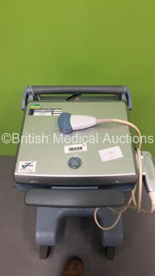 GE Voluson i Portable Ultrasound Scanner *S/N B02250* **Mfd 05/2009** Software Version 8.2.2.947 with 1 x Transducer / Probe (AB2-7-RS Ref H44901AD *Mfd 04/2013*) on GE Voluson Dock Cart (Powers Up - Damage to Machine - See Pictures) (W) ***IR034*** - 11