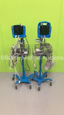 1 x GE Carescape Vital Signs Monitor on Stand with BP Hose and SPO2 Finger Sensor and 1 x GE ProCare Auscultatory Vital Signs Monitor on Stand with SPO2 Finger Sensor and BP Hose (Both Power Up)