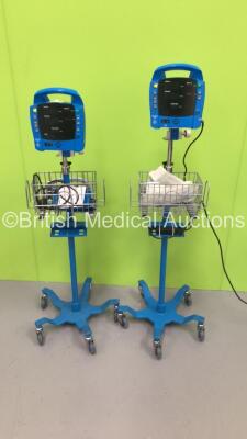 2 x GE ProCare Auscultatory 300 Patient Monitors on Stands with 1 x BP Cuff (1 x Powers Up with Error,1 x No Power) * SN AAW05360180SA / AAW05350134SA *