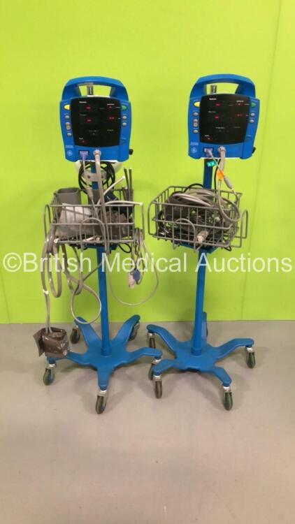 2 x GE Dinamap ProCare Auscultatory Vital Signs Monitor on Stand with SPO2 Finger Sensor and BP Hose (Powers Up)