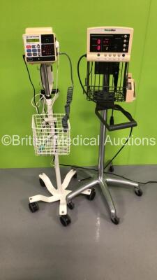 1 x CSI Criticare Vital Care 506DXN Vital Signs Monitor on Stand with SPO2 Finger Sensor and BP Hose and 1 x Welch Allyn 52000 Series Vital Signs Monitor on Stand (Both Power Up)