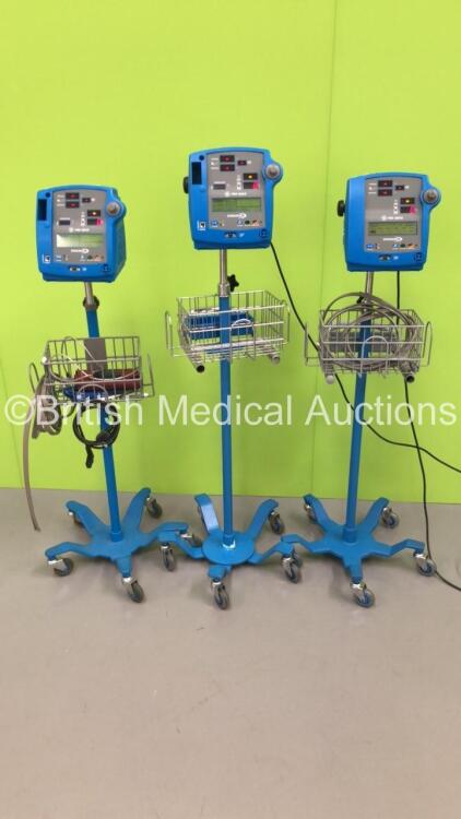 2 x GE Dinamap Pro 400V2 Patient Monitors on Stands with 1 x BP Hose and 2 x BP Cuffs and 1 x GE Dinamap Pro 300V2 Patient Monitor on Stand with 1 x BP Hose (All Power Up) * SN AAX07290056SA / AAX08370046SA / AAX04460069SA *