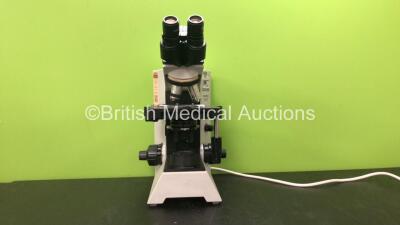 Olympus Model CH30RF200 Benchtop Microscope with 2 x Optics *1 x Olympus A10 PL 0.25 160/0.17 Optic and 1 x Olympus Plan 20x/0.40Ph1 Optic* (Powers Up)