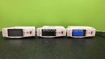 3 x Radical 7 Hand Held Pulse Oximeters with 3 x Baser / Charging Units (All Power Up, 2 Charging Units Not Charging Units Correctly)