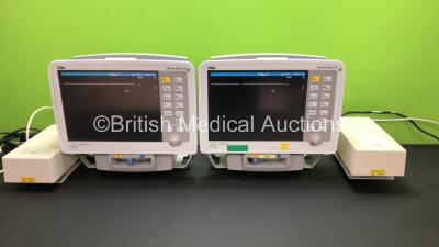 2 x Drager Infinity Delta XL Patient Monitors *Mfd 2009* with HemoMed 1, Aux/Hemo 2, Aux/Hemo 3, NBP and MultiMed Options, 2 x AC Power Supplies and 2 x Infinity Docking Stations (Both Power Up) *5399696647 - 5399688647*