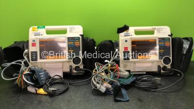2 x Medtronic Lifepak 12 Biphasic Defibrillators / Monitors Including ECG, SPO2, CO2, NIBP and Printer Options with 2 x SpO2 Finger Sensors, 2 x 4 Lead ECG Leads, 2 x NIBP Hoses with BP Cuffs and 4 x Batteries in Carry Cases (Both Power Up) *SN 37628570, 