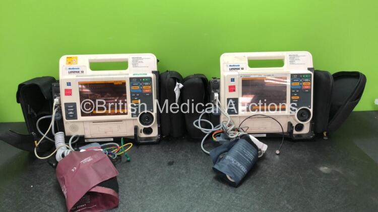 2 x Medtronic Lifepak 12 Biphasic Defibrillators / Monitors Including ECG, SPO2, CO2, NIBP and Printer Options with 2 x SpO2 Finger Sensors, 2 x 4 Lead ECG Leads, 2 x NIBP Hoses with BP Cuffs and 4 x Batteries in Carry Cases (Both Power Up) *SN 37628567,