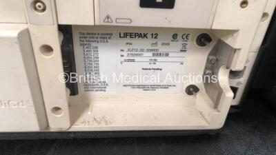2 x Medtronic Lifepak 12 Biphasic Defibrillators / Monitors Including ECG, SPO2, CO2, NIBP and Printer Options with 2 x SpO2 Finger Sensors, 2 x 4 Lead ECG Leads, 2 x NIBP Hoses with BP Cuffs and 4 x Batteries in Carry Cases (Both Power Up) *SN 37628567, - 9