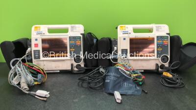 2 x Medtronic Lifepak 12 Biphasic Defibrillators / Monitors Including ECG, SPO2, CO2, NIBP and Printer Options with 2 x SpO2 Finger Sensors, 2 x 4 Lead ECG Leads, 2 x NIBP Hoses with BP Cuffs and 4 x Batteries in Carry Cases (Both Power Up) *SN 37632500, 