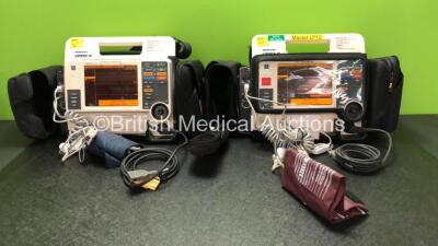 2 x Medtronic Lifepak 12 Biphasic Defibrillators / Monitors Including ECG, SPO2, CO2, NIBP and Printer Options with 2 x SpO2 Finger Sensors, 2 x NIBP Hoses with BP Cuffs and 4 x Batteries in Carry Cases (Both Power Up) *SN