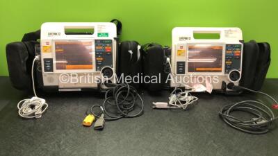 2 x Medtronic Lifepak 12 Biphasic Defibrillators / Monitors Including ECG, SPO2, CO2, NIBP and Printer Options with 2 x SpO2 Finger Sensors, 2 x NIBP Hoses with BP Cuffs and 4 x Batteries in Carry Cases (Both Power Up) *SN 37628553, 3768592*