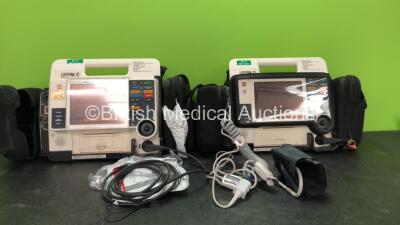 2 x Medtronic Lifepak 12 Biphasic Defibrillators / Monitors Including ECG, SPO2, CO2, NIBP and Printer Options with 1 x Defibrillator Electrode, 1 x SpO2 Finger Sensors, 1 x NIBP Hoses, 1 x BP Cuff and 4 x Batteries in Carry Cases (Both Power Up) *SN 3762