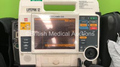2 x Medtronic Lifepak 12 Biphasic Defibrillators / Monitors Including ECG, SPO2, CO2, NIBP and Printer Options with 1 x Defibrillator Electrode, 1 x SpO2 Finger Sensors, 1 x NIBP Hoses, 1 x BP Cuff and 4 x Batteries in Carry Cases (Both Power Up) *SN 3762 - 2