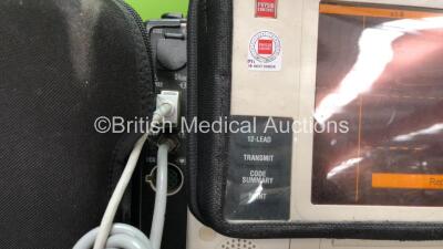 2 x Medtronic Lifepak 12 Biphasic Defibrillators / Monitors Including ECG, SPO2, CO2, NIBP and Printer Options with 1 x Defibrillator Electrode, 1 x SpO2 Finger Sensors, 1 x NIBP Hoses, 1 x BP Cuff and 4 x Batteries in Carry Cases (Both Power Up) *SN 3762 - 6