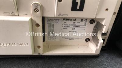 2 x Medtronic Lifepak 12 Biphasic Defibrillators / Monitors Including ECG, SPO2, CO2, NIBP and Printer Options with 1 x Defibrillator Electrode, 1 x SpO2 Finger Sensors, 1 x NIBP Hoses, 1 x BP Cuff and 4 x Batteries in Carry Cases (Both Power Up) *SN 3762 - 8