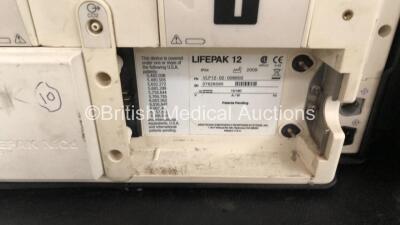 2 x Medtronic Lifepak 12 Biphasic Defibrillators / Monitors Including ECG, SPO2, CO2, NIBP and Printer Options with 1 x Defibrillator Electrode, 1 x SpO2 Finger Sensors, 1 x NIBP Hoses, 1 x BP Cuff and 4 x Batteries in Carry Cases (Both Power Up) *SN 3762 - 10