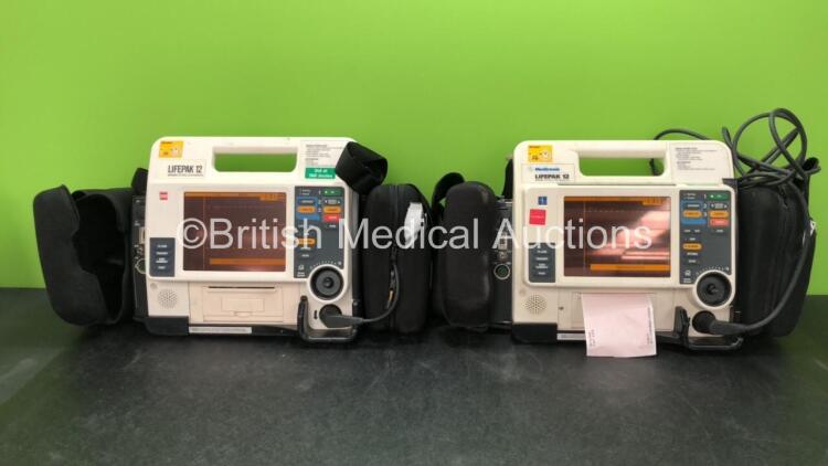 2 x Medtronic Lifepak 12 Biphasic Defibrillators / Monitors Including ECG, SPO2, CO2, NIBP and Printer Options with 2 x SpO2 Finger Sensors, 2 x NIBP Hoses and 4 x Batteries in Carry Cases (Both Power Up) *SN 37808486, 37632503*
