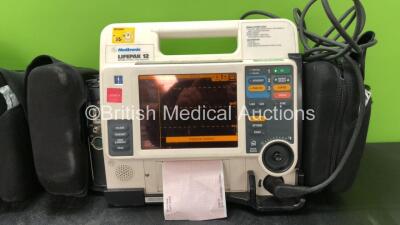 2 x Medtronic Lifepak 12 Biphasic Defibrillators / Monitors Including ECG, SPO2, CO2, NIBP and Printer Options with 2 x SpO2 Finger Sensors, 2 x NIBP Hoses and 4 x Batteries in Carry Cases (Both Power Up) *SN 37808486, 37632503* - 4