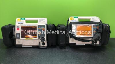 2 x Medtronic Lifepak 12 Biphasic Defibrillators / Monitors Including ECG, SPO2, CO2, NIBP and Printer Options with 4 x Batteries in Carry Cases (Both Power Up, One with Damaged Casing-See Photo) *SN 37620269, 37808470*