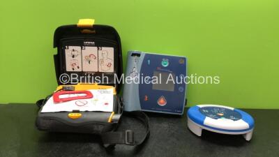 Mixed Lot Including 1 x Medtronics Lifepak CR Plus Defibrillator with 1 x Battery and 1 x Physio Control Adult Defibrillation Pad *Exp 07/2021* in Case (Powers Up) 1 x Agilent FR2 Defibrillator with 1 x Philips M3863A Battery (Powers Up with Failed Self T