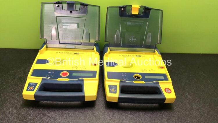 2 x Cardiac Science Powerheart AED G3 Defibrillators with 2 x Batteries (1 Powers Up, 1 No Power with Missing Shock Button-See Photo)